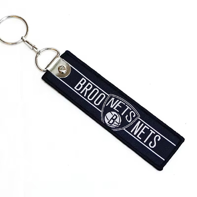 Zastosowane logo promocyjne prezent łańcuchy do kluczy podwójnie stronne tkaniny haftowania Flight Key Ring